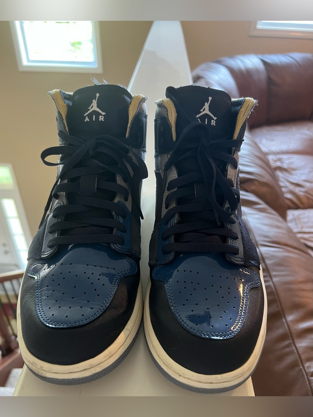 Nike Air Jordan 1 Mid Men’s Sneakers Obsidian, French Blue, Slate and White.